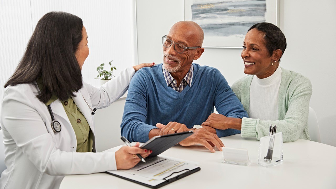 American American couple consulting with a physician