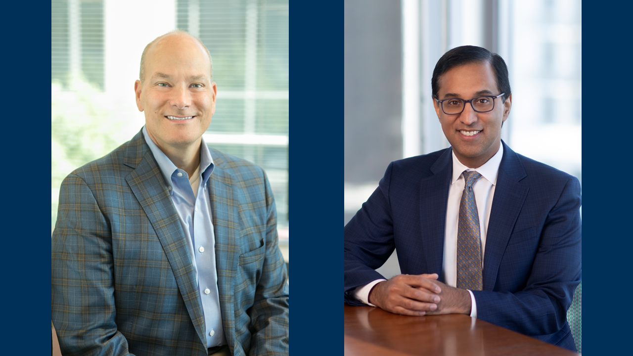 George Renaudin head shot and Sanjay Shetty headshot sitting at a table